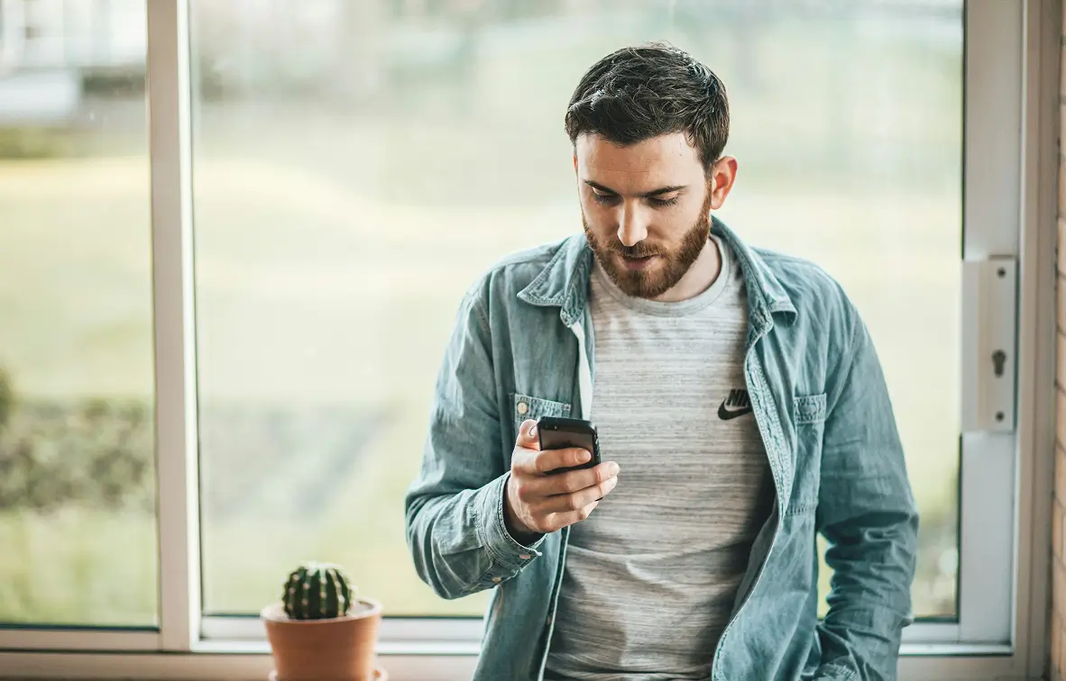 Man checking mortgage options on phone